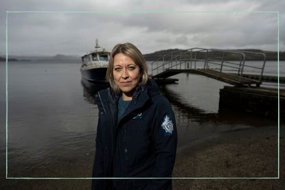 Nicola Walker as Annika stood in front of the sea on a cloudy day