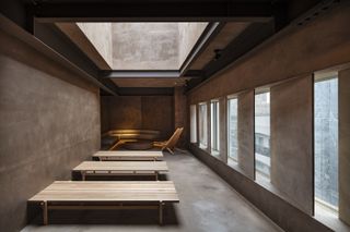 minimalist wellness area inside Nekoyacho Bldg by Suppose Design Office