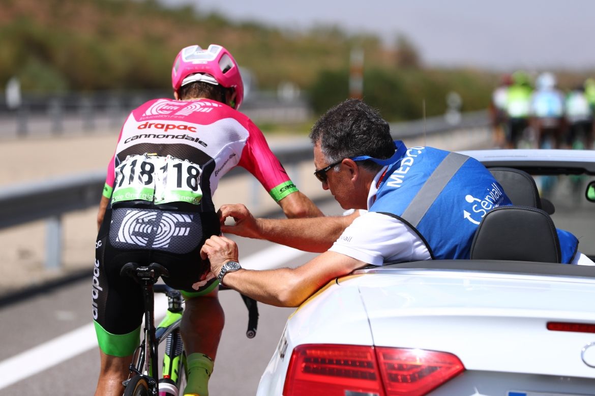 Michael Woods (EF-Drapac) is treated by the race doctor.