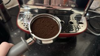 Ground coffee in espresso machine basket