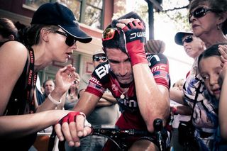 George Hincapie is consoled by his family after losing the 2011 US pro road race to Matthew Busche.