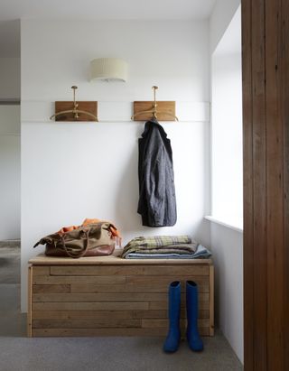 compact boot room storage bench and industrial style hooks