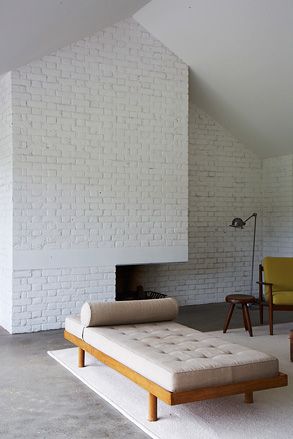 seating area with white brick wall