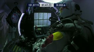Daredevil Felix Baumgartner is seen inside his Red Bull Stratos capsule while ascending higher than 100,001 feet during his Oct. 14, 2012, attempt to make the world's highest skydive and break the sound barrier during freefall.