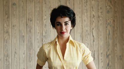 elizabeth taylor on a wood background