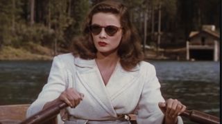 Gene Tierney pictured rowing a boat with a stern expression in Leave Her To Heaven.