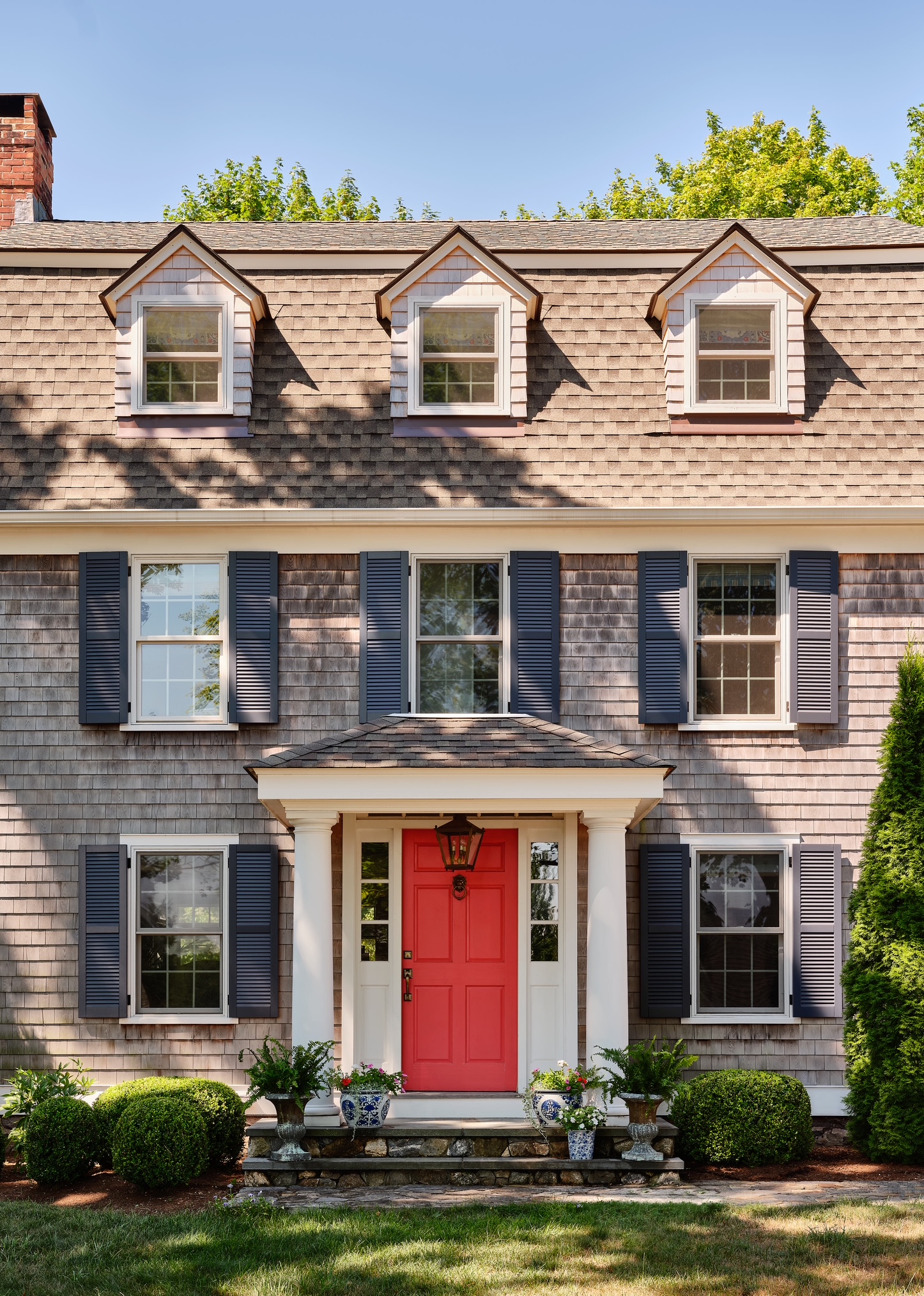 front of home with red door