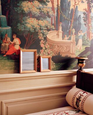 Wooden picture frames against frescoed wall