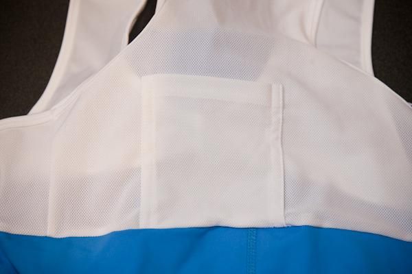 The bibs come with a radio/media pocket tucked in the back.