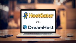 HostGator and DreamHost logo on a laptop screen placed on a brown table