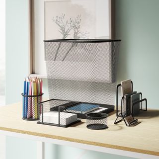 A 6-piece black metal desk organizer set consisting of a trash can, a two-piece filing cabinet, a notepad holder, a business card holder, a pen holder and a clipboard.