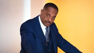 Vance looking down at NCIS bullpen