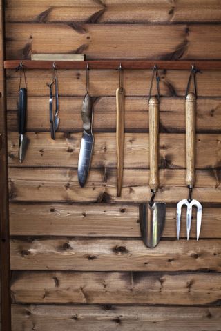 shed storage ideas: hanging tools inside shed