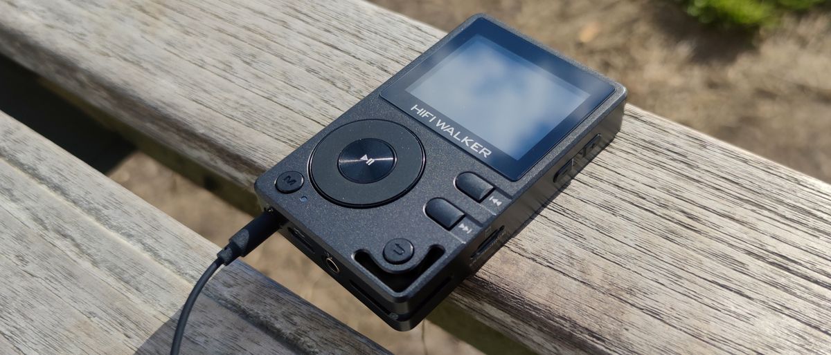 The HiFi Walker H2 on a wooden bench.