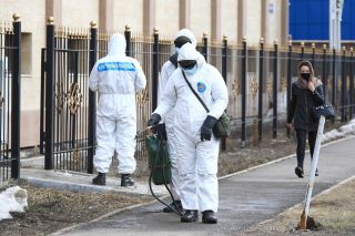 Officials in Astana, Kazakhstan carry out disinfection measures due to COVID-19 on March 30.