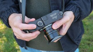 Leica M11-P camera top down held in hands