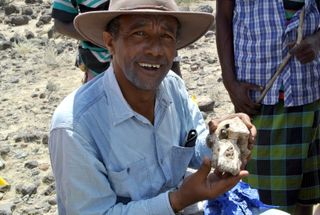 yohannes haile-selassie, phd with the cranium of australopithecus