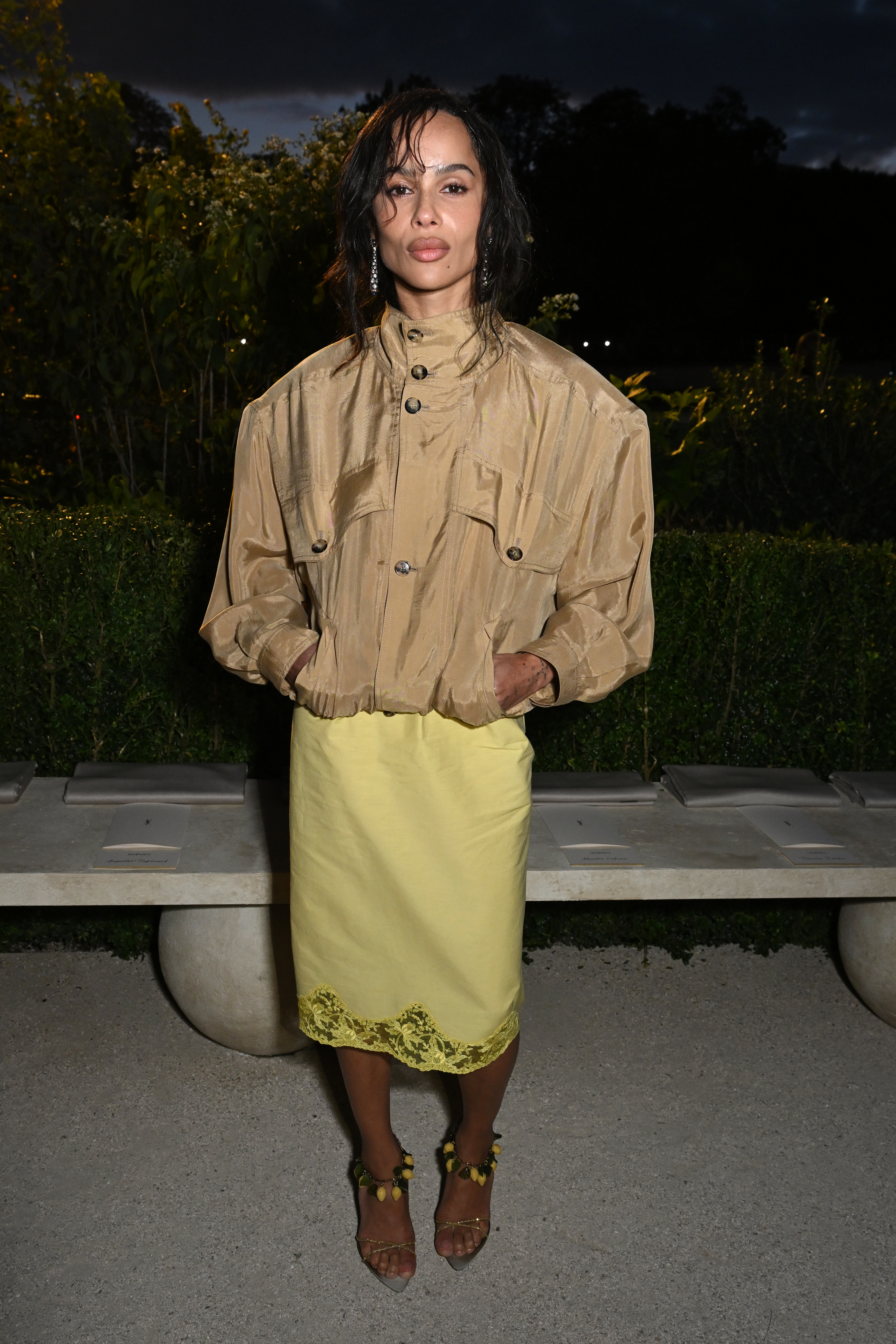 Zo&amp;euml; Kravitz in a funnel neck jacket and lace-trim skirt