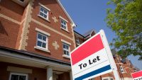 A house available with a To Let sign in front of it