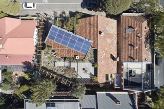 Aerial view, showing the new house set at an angle to the existing property