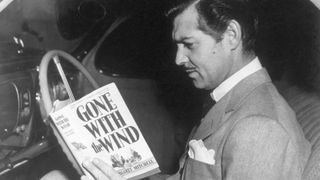 Clark Gable reading Gone with the Wind