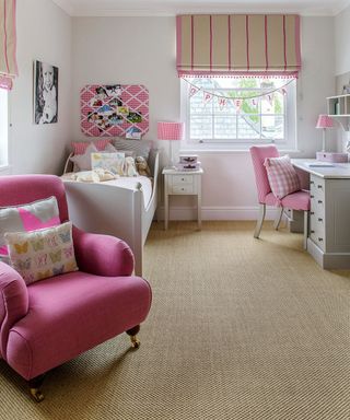 children room with carpet flooring and pink and white furniture