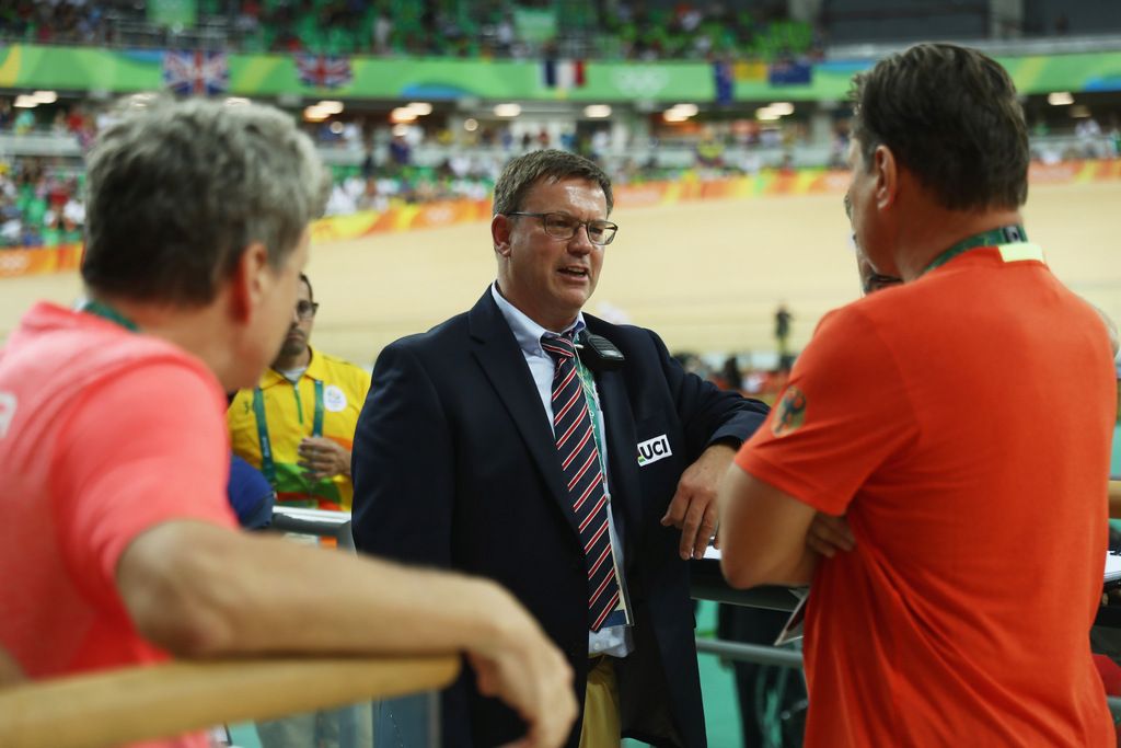 The UCI officials discuss what to do after issues with the derny in the keirin final