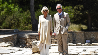 Britain's Prince Charles (R), the Prince of Wales and Britain's Camilla, the Duchess of Cornwall, arrive at the Archeological site of Knossos, in the southern island of Crete, on May 11, 2018