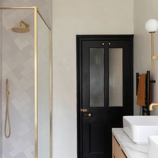 modern bathroom with green tub, gold shower and double sink