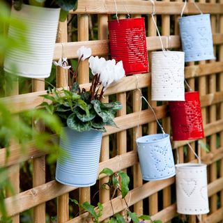 garden fence with planters and lanterns