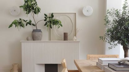 a ridged fireplace with a dining table in front