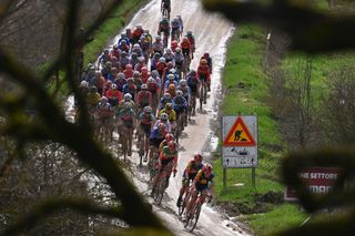 The peloton during Strade Bianche 2024