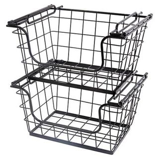 Back wire storage baskets stored on top of one another on a white background