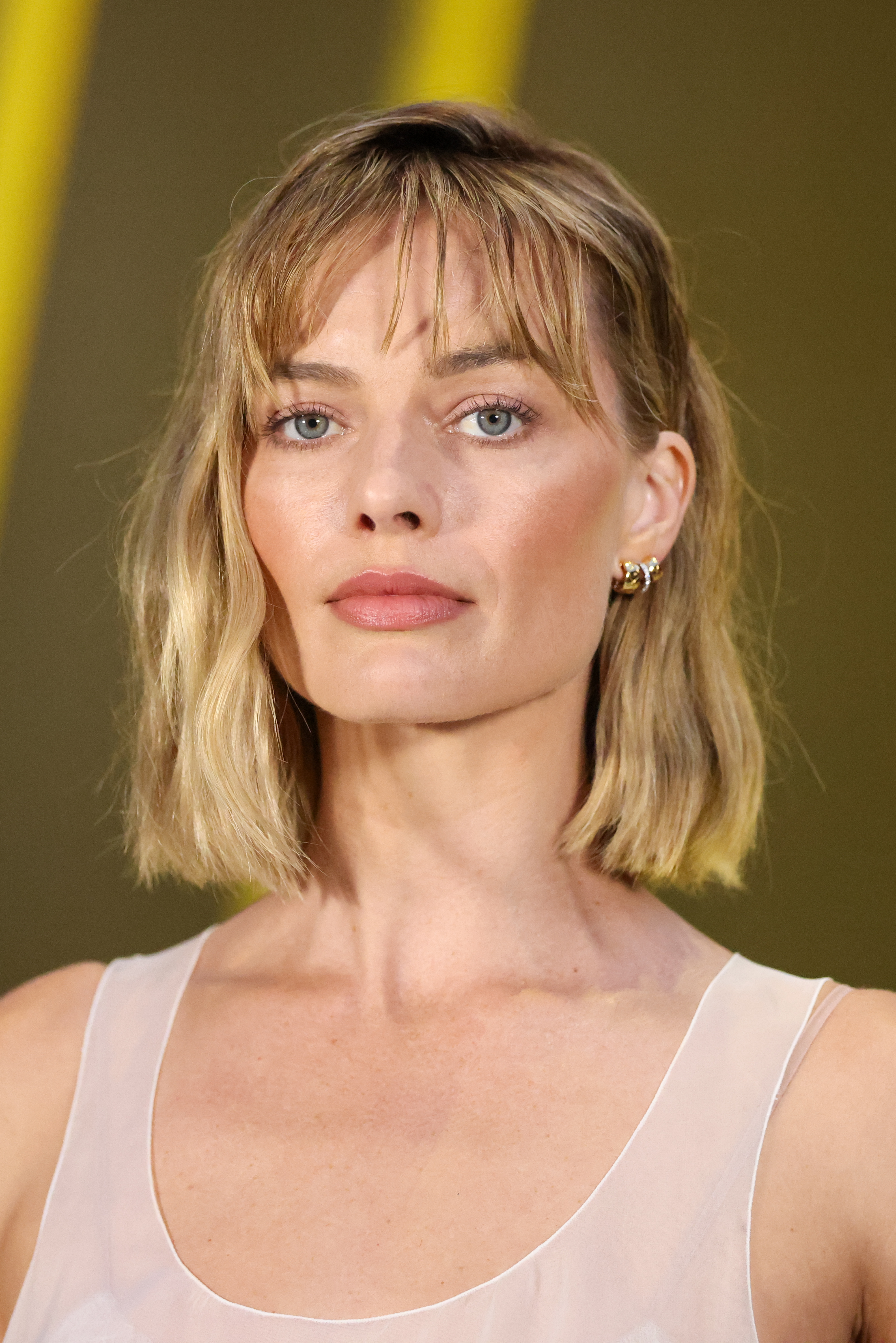 Margot Robbie with textured lob haircut with wispy fringe
