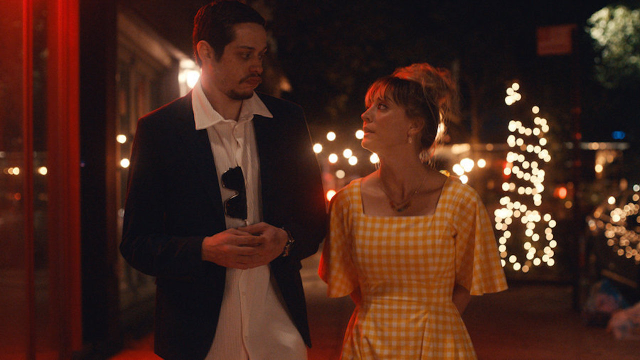Pete Davidson and Kaley Cuoco walking in the evening in Meet Cute 2022 Peacock movie