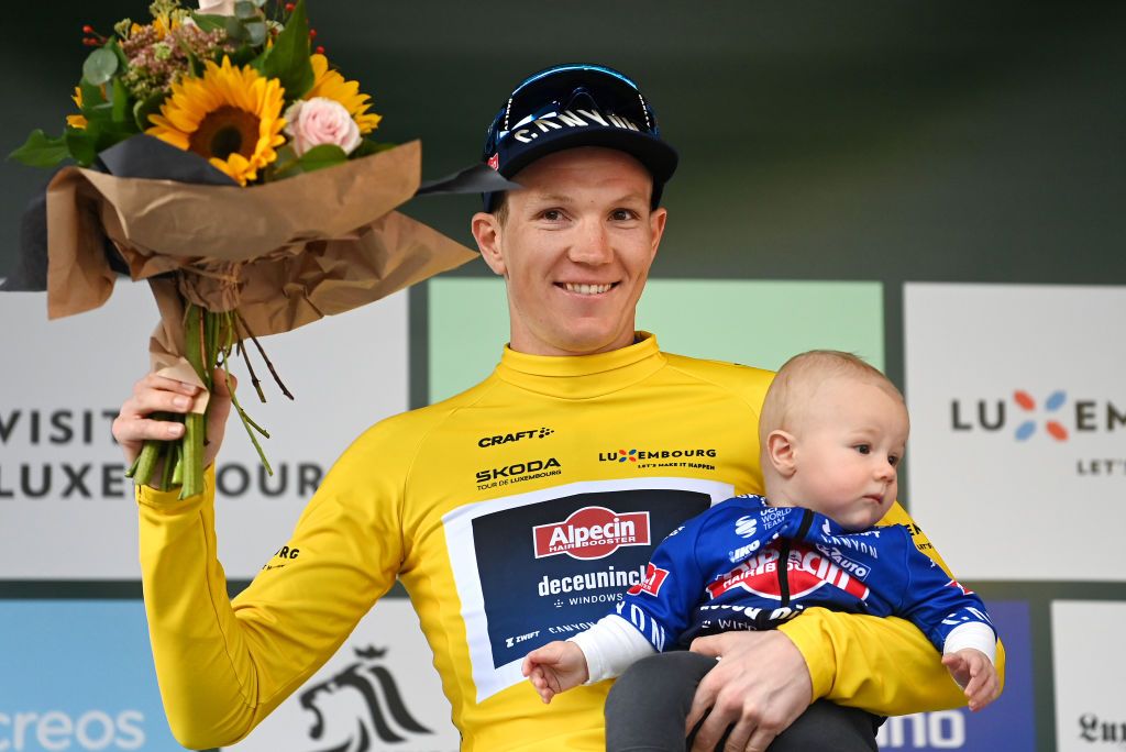 MAMER LUXEMBOURG SEPTEMBER 21 Soren Kragh Andersen of Denmark and Team AlpecinDeceuninck celebrates at podium as Yellow leader jersey winner with his son during the 83rd Skoda Tour Luxembourg 2023 Stage 2 a 1839km stage from MondorflesBains to Mamer UCIWT on September 21 2023 in Mamer Luxembourg Photo by Tim de WaeleGetty Images3
