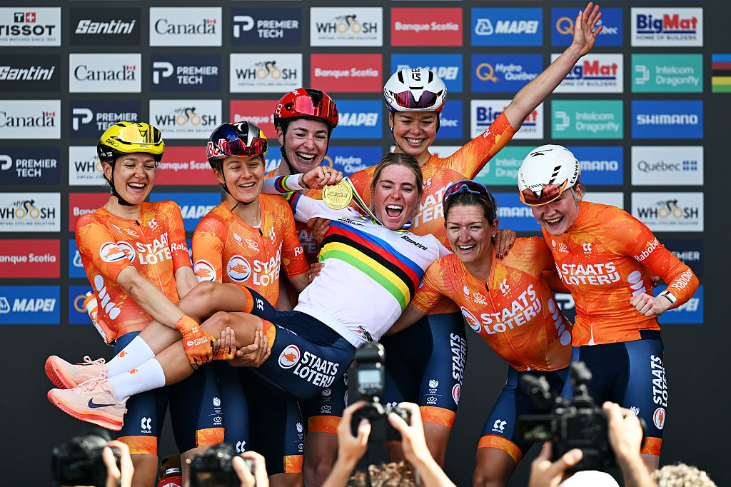 MONTREAL, QUEBEC - SEPTEMBER 26: Gold medalist, Demi Vollering of Team Netherlands and her team-mates Amber Kraak, Femke De Vries, Riejanne Markus, Lieke Nooijen, Puck Pieterse, Karlijn Swinkels, celebrate on the podium during the 99th UCI Road World Championships Montreal 2026 - Women Elite Road Race a 180.1km one day race from Brossard to Montreal on September 26, 2026 in Montreal, Quebec. (Photo by Tim de Waele/Getty Images)