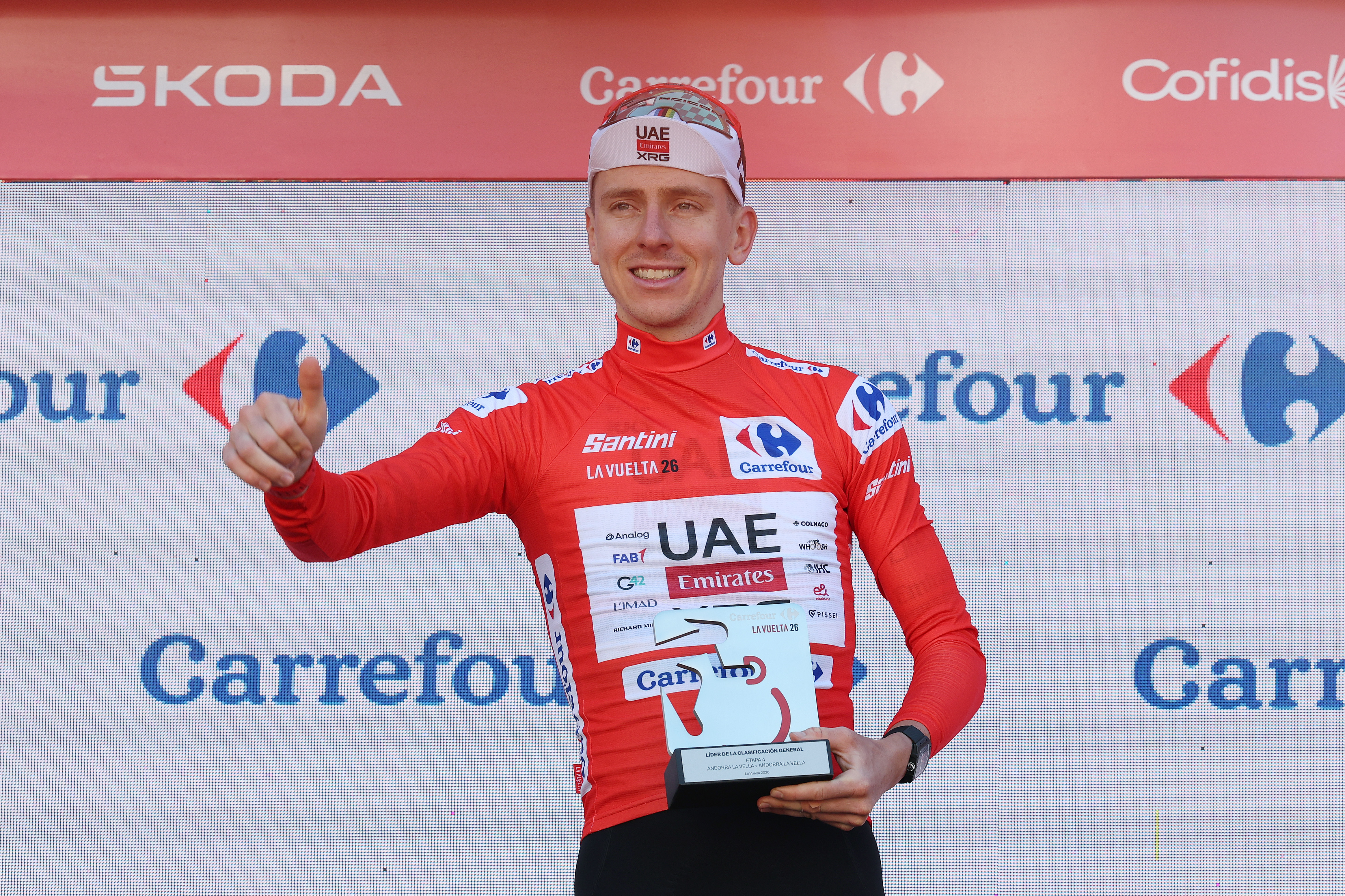 Tadej Pogacar celebrates on the podium in the Red Leader's Jersey of the Vuelta a Espa&amp;ntilde;a after winning stage 4 in Andorra (Photo by Alexander Hassenstein/Getty Images)