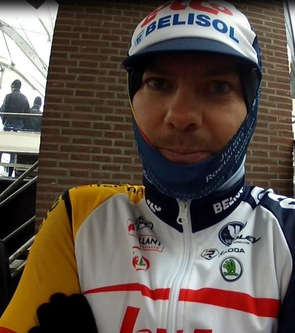 Greg Henderson (Lotto Belisol) tries to stay warm before the sign on at Gent-Wevelgem