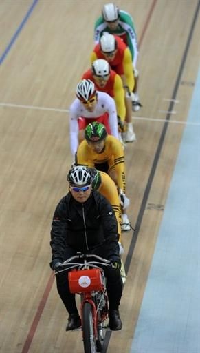 Riders are paced by a derny at the start of the men's keirin final.