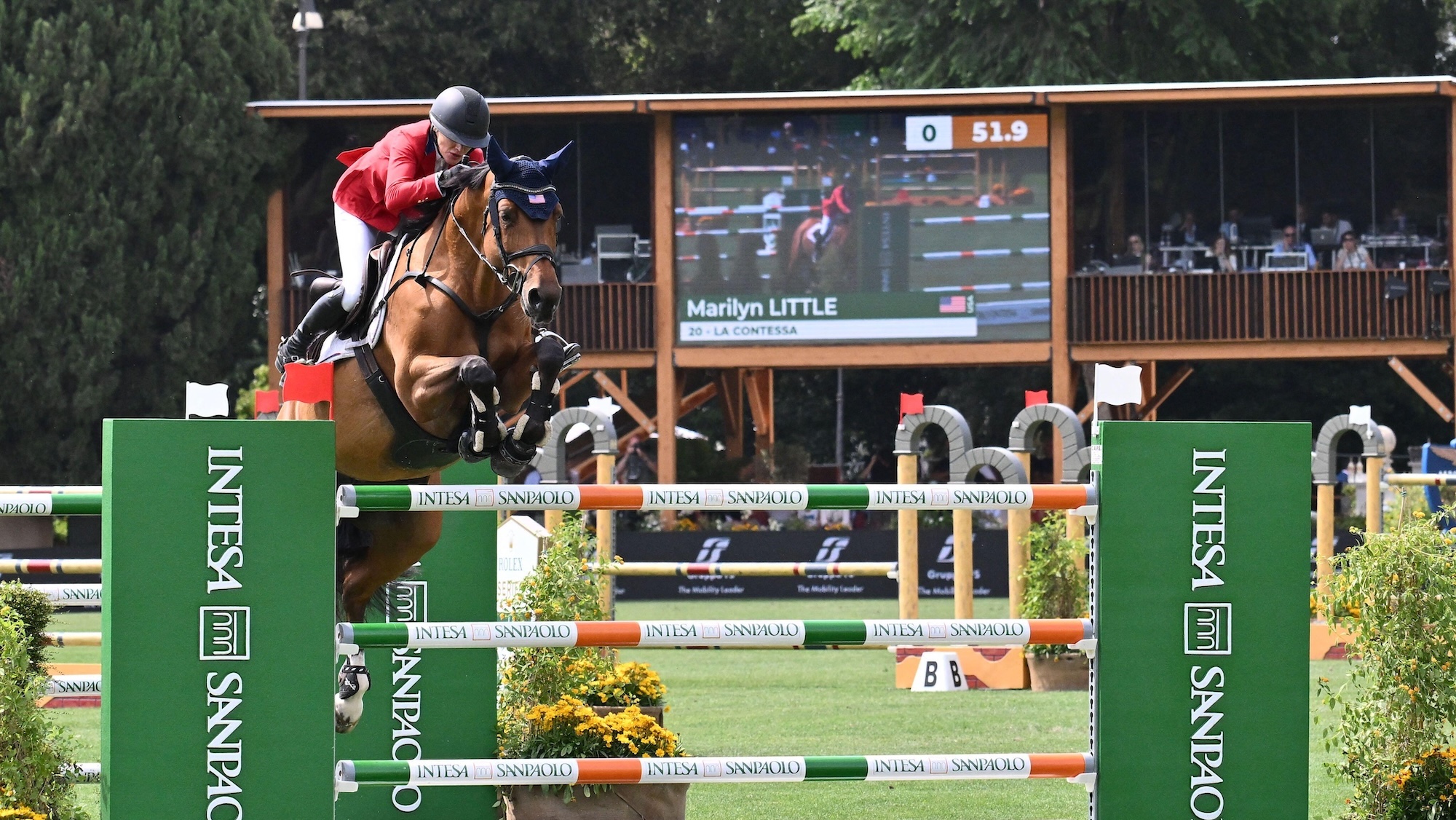 Marilyn Little and La Contessa jumping a fence