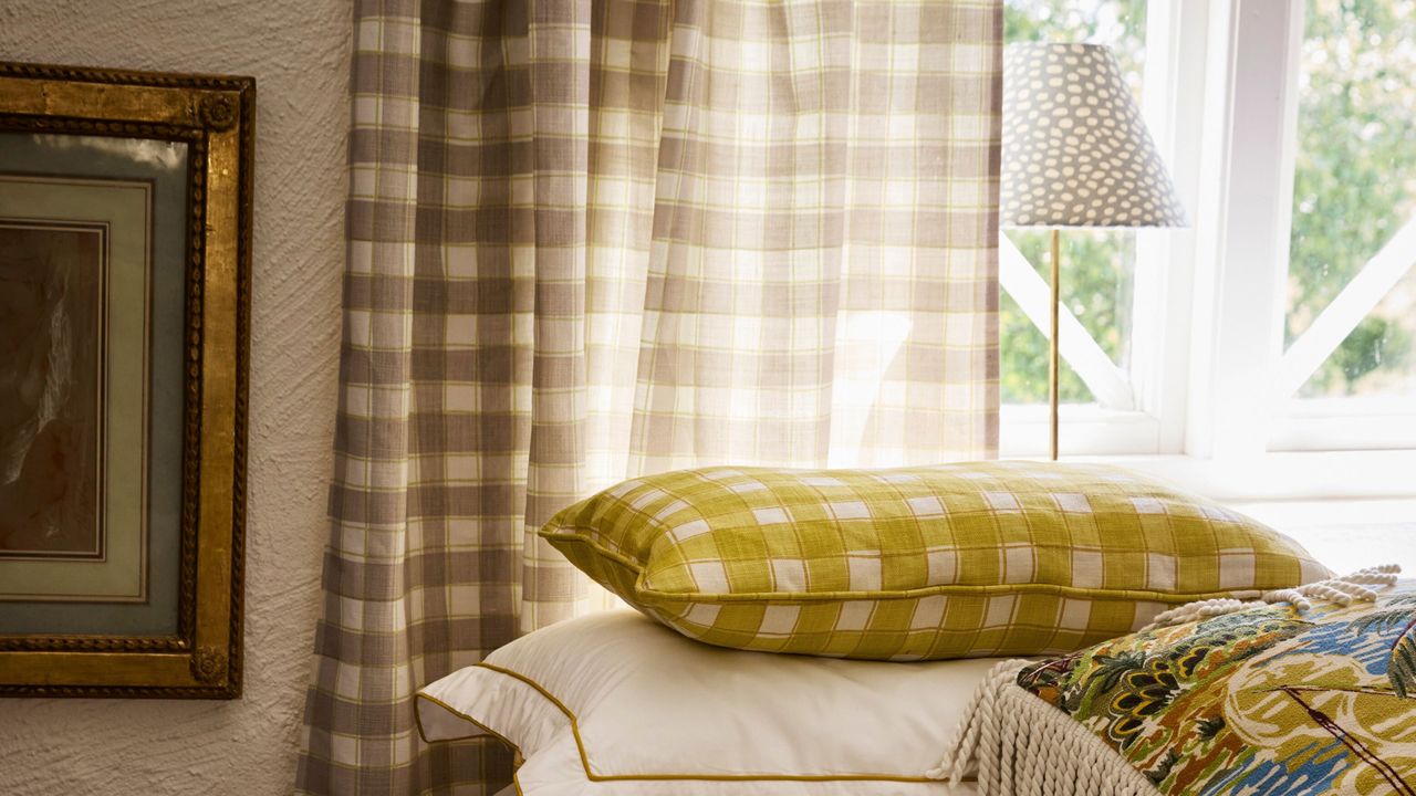 Plaid curtains hanging in a bedroom