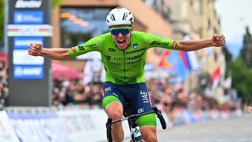 Slovenia&#039;s Tadej Pogacar celebrates as he crosses the finish line to win the men&#039;s Elite Road Race cycling event during the UCI 2024 Road World Championships, in Zurich, on September 29, 2024. 