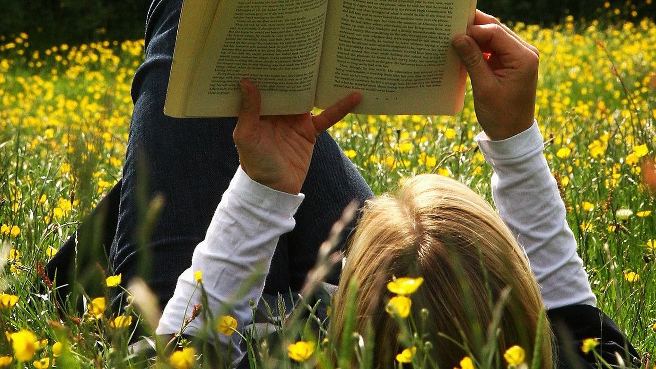 A teenager reading a book