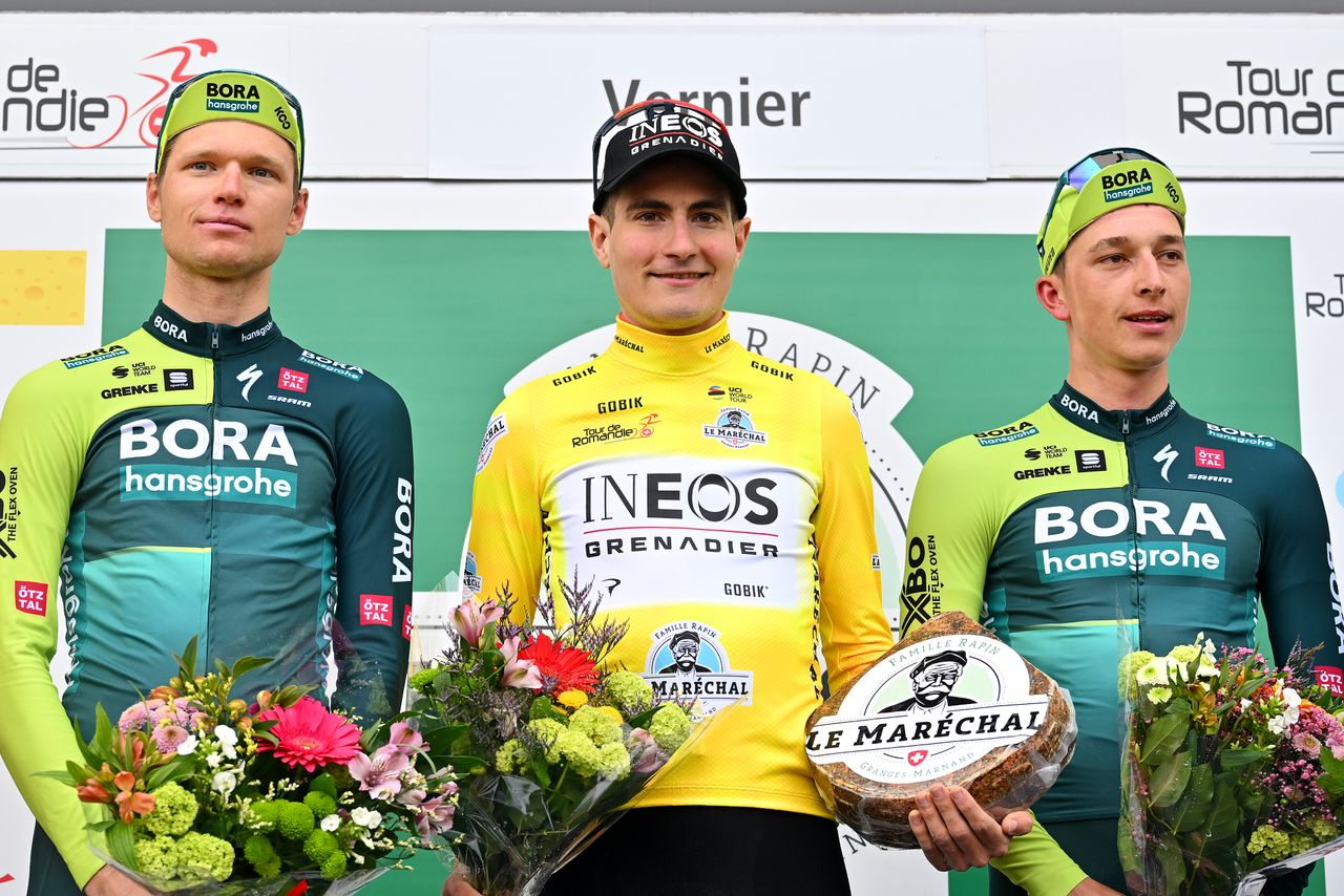 Carlos Rodríguez alongside Aleksandr Vlasov and Florian Lipowitz on the final podium of the Tour de Romandie