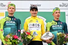 Carlos Rodríguez alongside Aleksandr Vlasov and Florian Lipowitz on the final podium of the Tour de Romandie