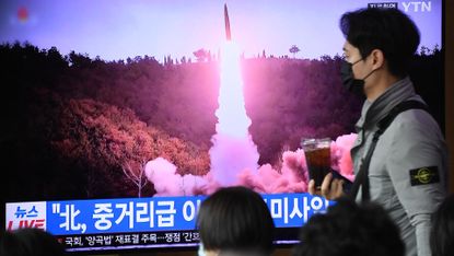 news broadcast shows north korean missile test