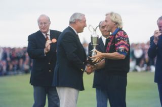 Norman holds the claret jug