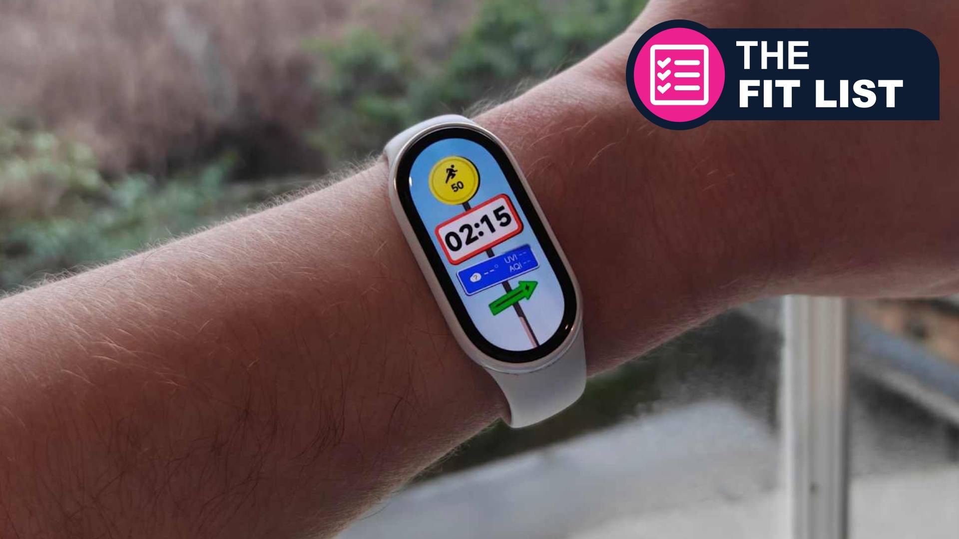 Caucasian man wearing xiaomi fitness tracker with TR Fit List badge