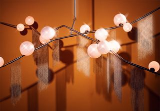 Cherry Bomb Frince’ chandelier, by Lindsey Adelman, machined brass, bras chain and hand-blown glas with gold foil